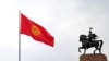 The flag of Kyrgyzstan and the statue of Manas. Bishkek city, January 8, 2024