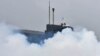 RUSSIA -- SEVEROMORSK, RUSSIA – AUGUST 11, 2016: A a radiological, chemical and biological defence unit takes part in a military drill to create smoke screens to conceal Russian Northern Fleet submarines.